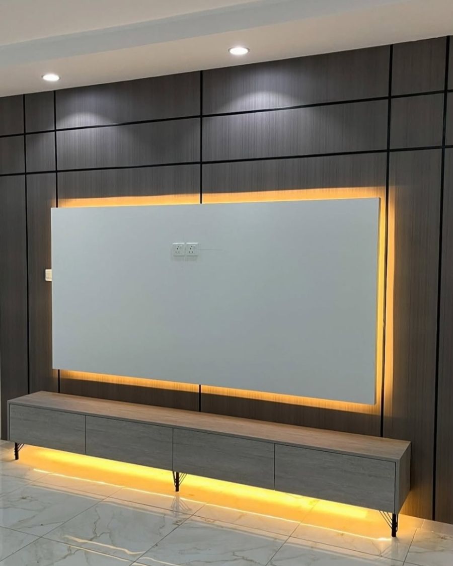 Dark panelled wall with warm backlight and floating console