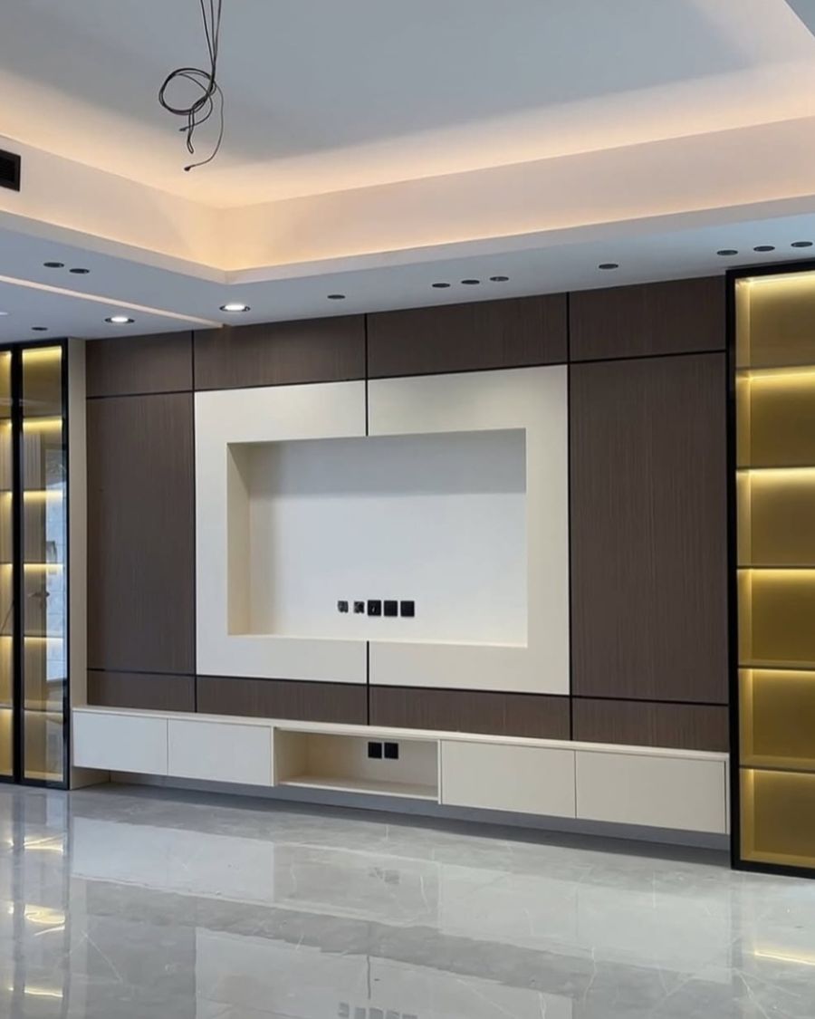 Cream and timber layered media wall with lit niches